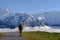 Tourist walking with a backpack in the mountains at Grindewald, Switzerland. Mountain hiking in the high mountains