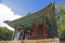 A tourist walking into a building in Changdeokgung secret garden, Seoul