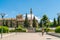 Tourist walking in front of the Fountain at the Jardines Del Triunfo