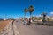 Tourist walking in Las Americas coastline on February 23, 2016 in Adeje, Tenerife, Spain.