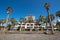 Tourist walking in Las Americas coastline touristic resorts, in Tenerife, Spain.