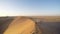 Tourist walking in the majestic Namib desert