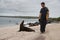 Tourist walking by a seal