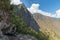 Tourist walking to Inca Bridge at Machu Picchu, Peru