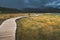 Tourist walking on the wooden path. Ireland.