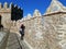 Tourist wandering on the medieval city walls of Avila, Spain