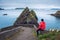 Tourist watching giant cliffs and irish islands at the Dunquin Pier, Dingle Peninsula, Ireland