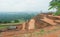 Tourist watching natural landscape with ancient pond of Sigiriya city, ruins and archeological area in Sri Lanka.