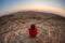 Tourist watching the stunning view of barren valley in the Namib desert, among the most important travel destination in Namibia