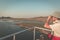 Tourist watching wildlife by binocular while on boat cruise on Chobe River, Namibia Botswana border, Africa. Chobe National Park,