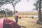 Tourist watching wildlife by binocular from camping site on Chobe River, Namibia Botswana border, Africa. Chobe National Park