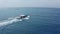 Tourist white and blue motorboat catamaran sails on ocean