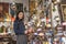 Tourist woman in arab souvenir shop looking lamps and souvenirs