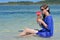 Tourist woman drinks a tropical cocktail in the waters of a resort on an island in Fiji
