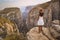 Tourist woman on the edge of a cliff of Tazi Canyon in Manavgat, Antalya, Turkey. Greyhound Canyon, Wisdom Valley.