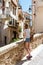 Tourist Woman Exploring Vintage Architecture Of Historic Houses Downtown Charming Streets Of Cannes