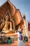 Tourist Woman Having Fun While Sightseeing in The Temple, Asian Woman Relaxing and Enjoyment While Photographing Statue of Buddha