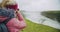 Tourist woman looking at Gullfoss waterfall the famous attraction and landmark destination on Iceland on the Golden