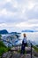 Tourist woman looks on the Alesund cityscape from Aksla viewpoint. Norway