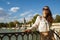 Tourist woman at Parque del Buen Retiro looking into distance