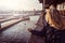 Tourist woman at Pier 39, San Francisco, California, looking at sea lions