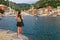 Tourist woman in Portofino, Liguria, Italy. Scenic fishing village with traditional houses and clear blue water. Summer vacation