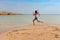 Tourist woman at the Red Sea coast in the Ras Mohammed National Park. Famous travel destionation in desert. Sharm el Sheikh, Sinai