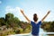 Tourist woman on river boat rejoicing while having river voyage