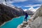 Tourist woman staring at the amazing Lake Paron in Cordillera Blanca of Peru