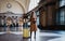 Tourist woman with suitcase on platform station in Barcelona. Girl traveler waiting train enjoy holiday weekend vacation