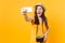 Tourist woman in summer casual clothes, hat doing taking selfie shot on mobile phone isolated on yellow background