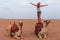 Tourist woman in traditional arabian clothes with camel in the Sinai Desert, Sharm el Sheikh, Sinai Peninsula, Egypt