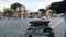 Tourist woman trash used plastic bottle on street garbage can in Rome city center,recycle concept