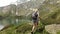 Tourist woman trekking by Robiei lake