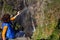 Tourist woman by Voringsfossen waterfall, Norway