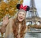 Tourist woman ÑˆÑ‚ Minnie Mouse Ears in Paris handwaving