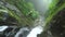 Tourist Women Is Sent By Zip Line Over The Waterfall While Canyoning