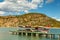 A tourist yacht stands near the pier. Mediterranean Sea. Turtle