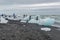 Touristic activity in Glacier Lagoon Jokulsarlon with icebergs in Iceland, summer