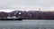 Touristic antarctic cruise liner following the black bird in the lagoonwith rocks of Deception Island, Antarctica