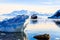 Touristic antarctic cruise ship among the icebergs with glacier