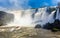 Touristic boat heading towards the powerfull stream of Iguazy Falls panorama, Puerto Iguazu Argentina