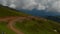 Touristic cable railway in mountains, aerial shot, top of mount