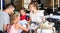 Touristic family relaxing in cafe looking map