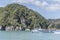 Touristic passenger vessel sailing at Awaroa bay, near Kaiteriteri, Abel Tasman park, New Zealand