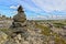 Touristic pyramid balanced stack of stones at the tundra