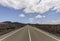 Touristic road through the lonely dark volcanic lava landscape of Timanfaya National Park, Lanzarote, Canary Islands, Spain