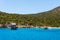 Touristic ships and tourists swimming in the Aegean sea in the city of Bodrum