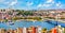 Touristic sightseeing ships in Golden Horn bay of Istanbul and mosque with Sultanahmet district against blue sky and clouds.