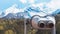 Touristic telescope look at the city with view snow mountains, metal binocular on background viewpoint observe vision, closeup